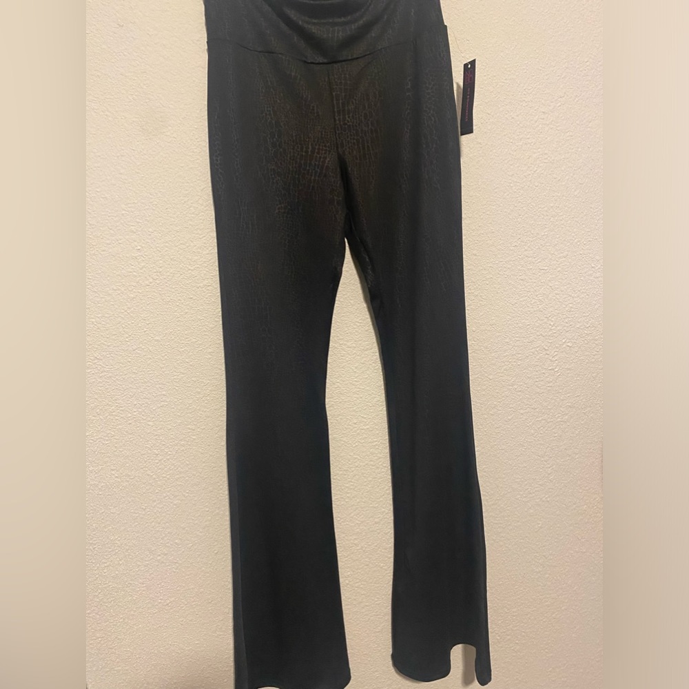 Black polyester/spandex with a hint of snake pattern.